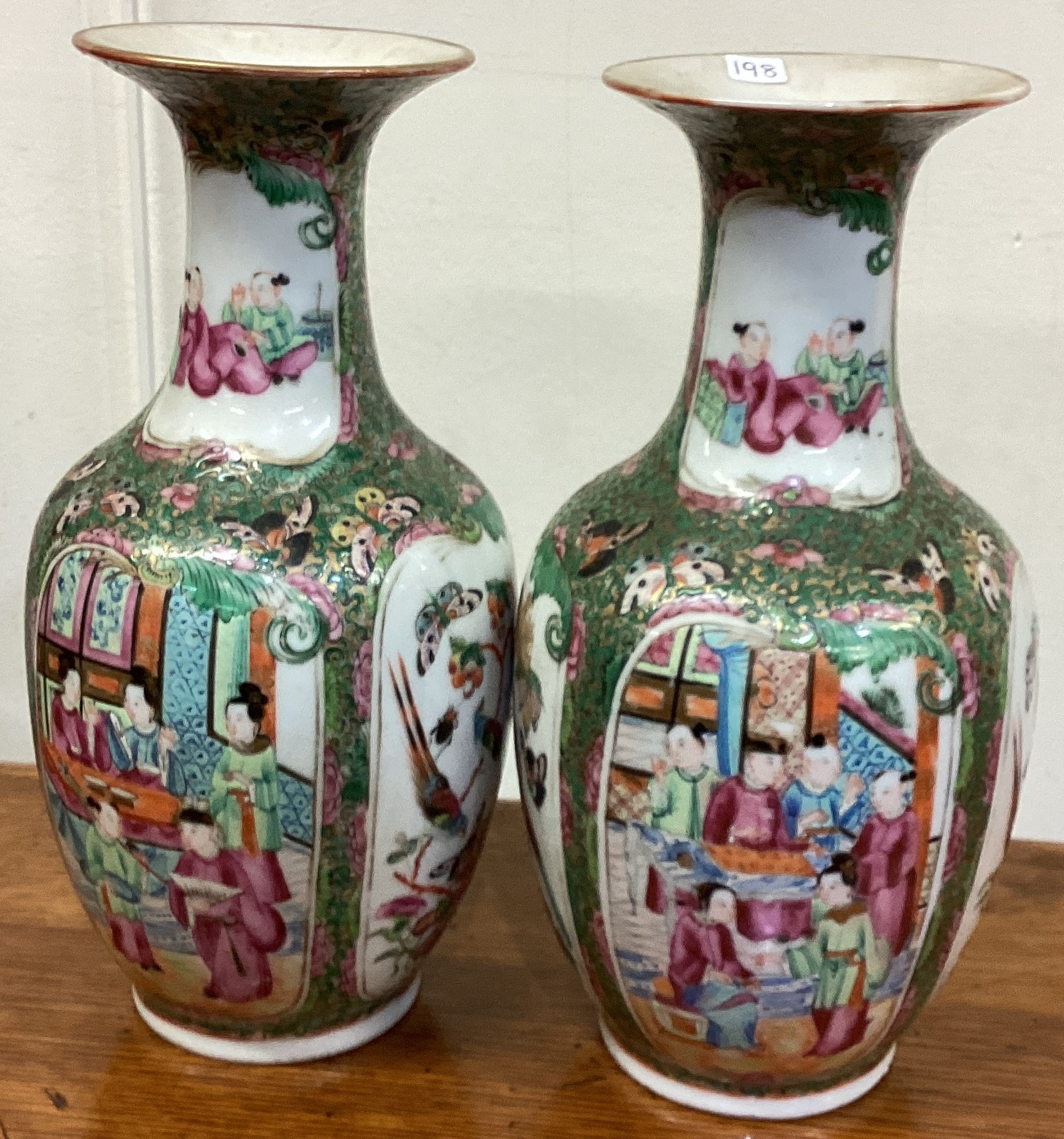 A pair of Canton vases with figural decoration.