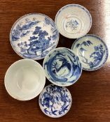 A group of blue and white saucers, dishes etc.