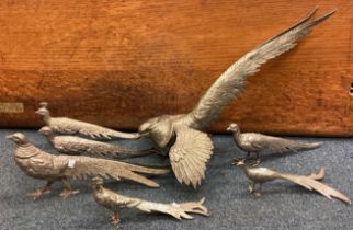 A collection of seven metal birds.