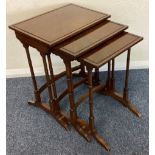 A mahogany nest of three tables.