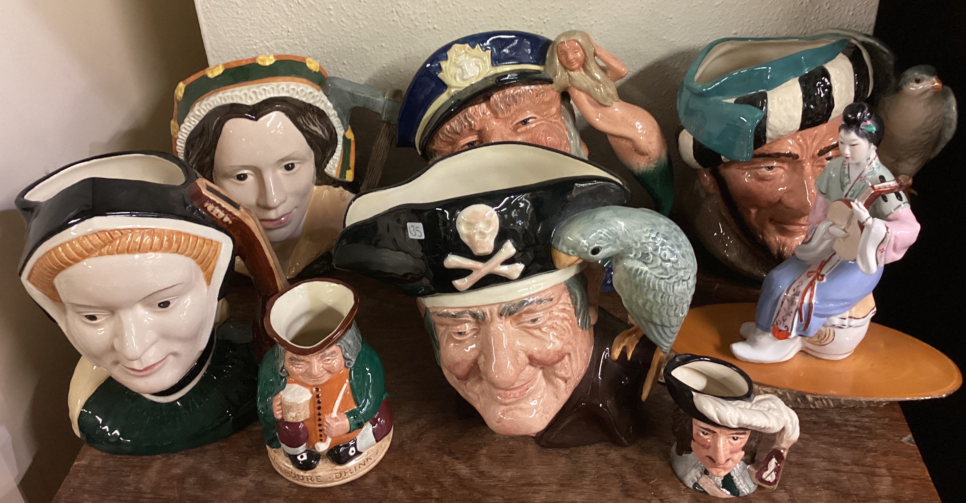 A collection of Royal Doulton "Toby" character jugs.