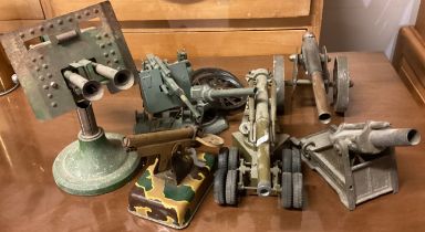 A collection of old toy Military guns etc.