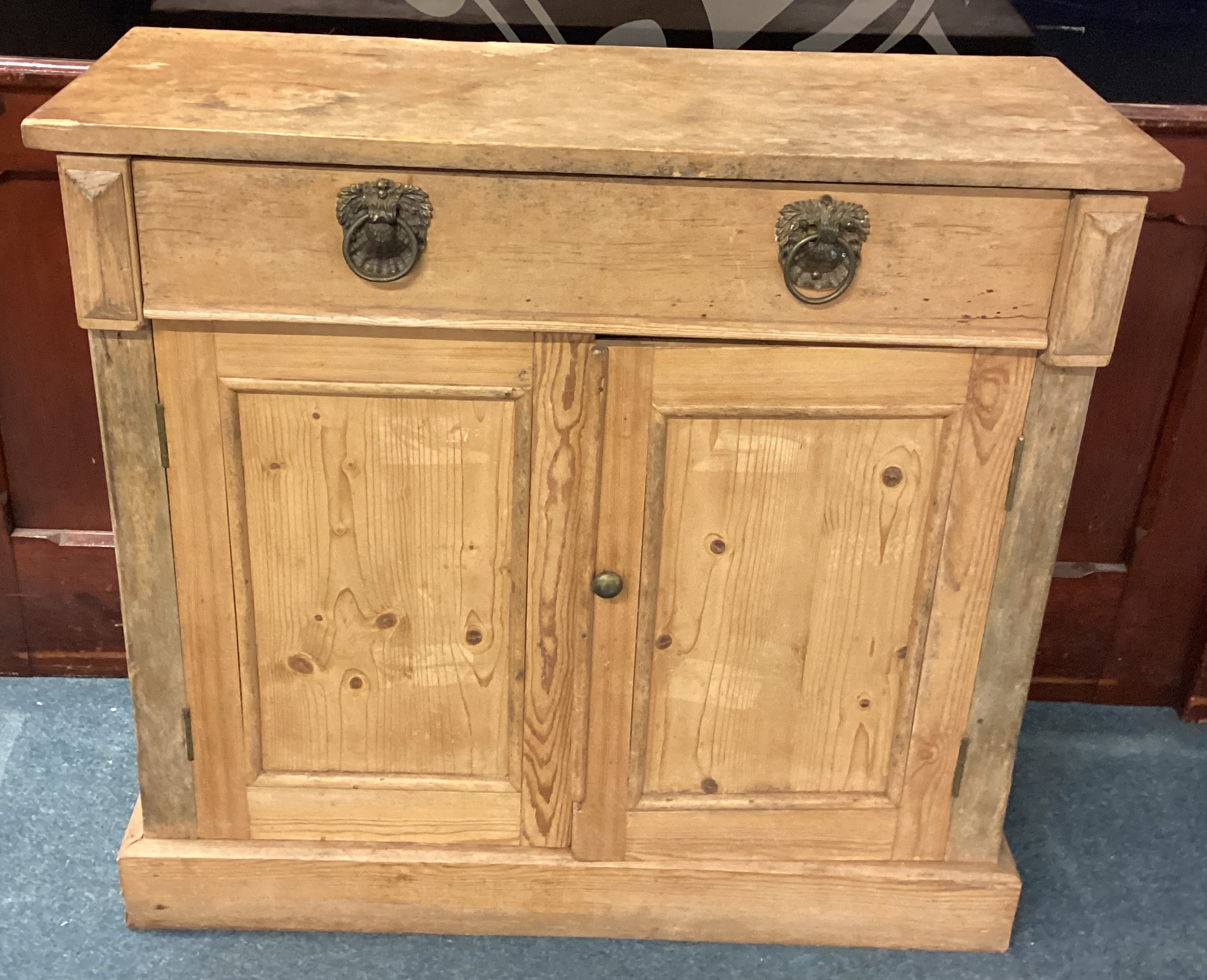 A single drawer pine sideboard.