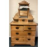 A stripped pine dressing chest with mirror.