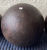 A large filled single cannon ball.