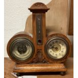 An old oak barometer / clock.