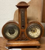 An old oak barometer / clock.