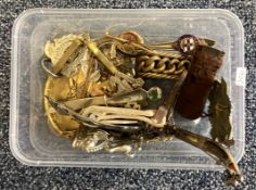A box containing old Military badges, buckle etc.