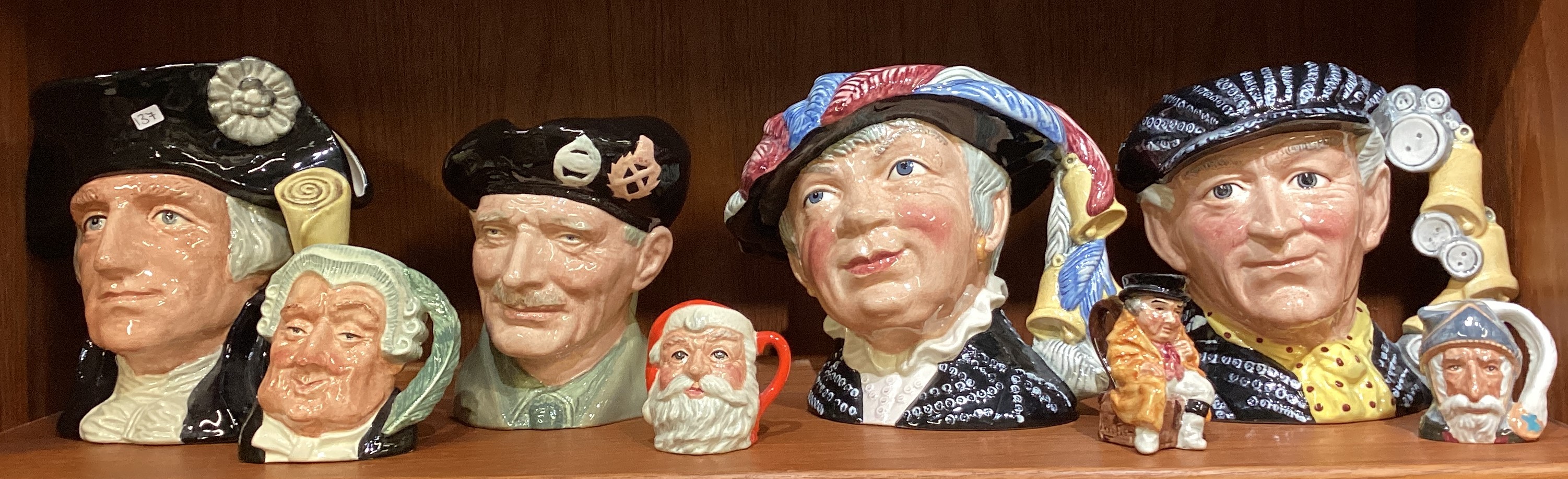 A collection of Royal Doulton "Toby" character jugs.