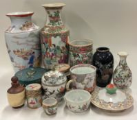 A large collection of Chinese vases and bowls.