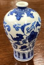 A good Chinese miniature blue and white baluster shaped vase with flora decoration.