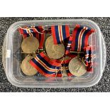 A box containing numerous 1935 -1949 War medals.