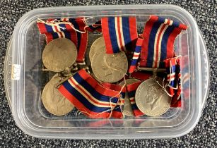 A box containing numerous 1935 -1949 War medals.