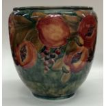 WILLIAM MOORCROFT: An early "Pomegranate" bowl on mottled green ground.