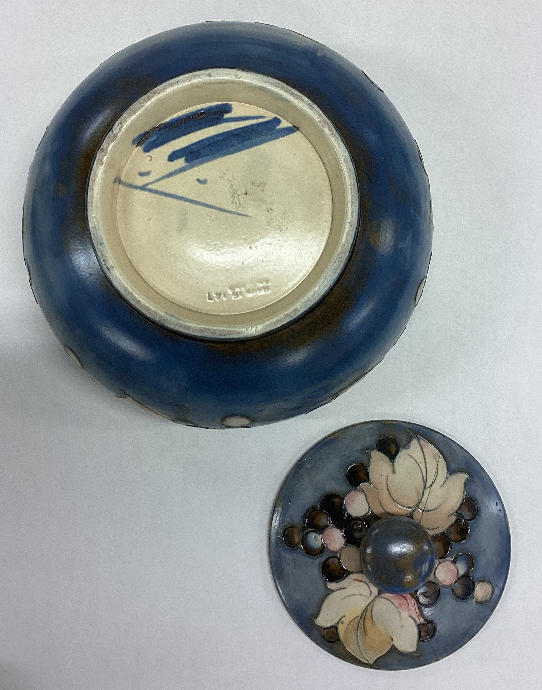WILLIAM MOORCROFT: A squat powder jar and cover decorated with leaves and berries. - Image 3 of 3