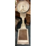 A pair of large vintage bathroom scales.