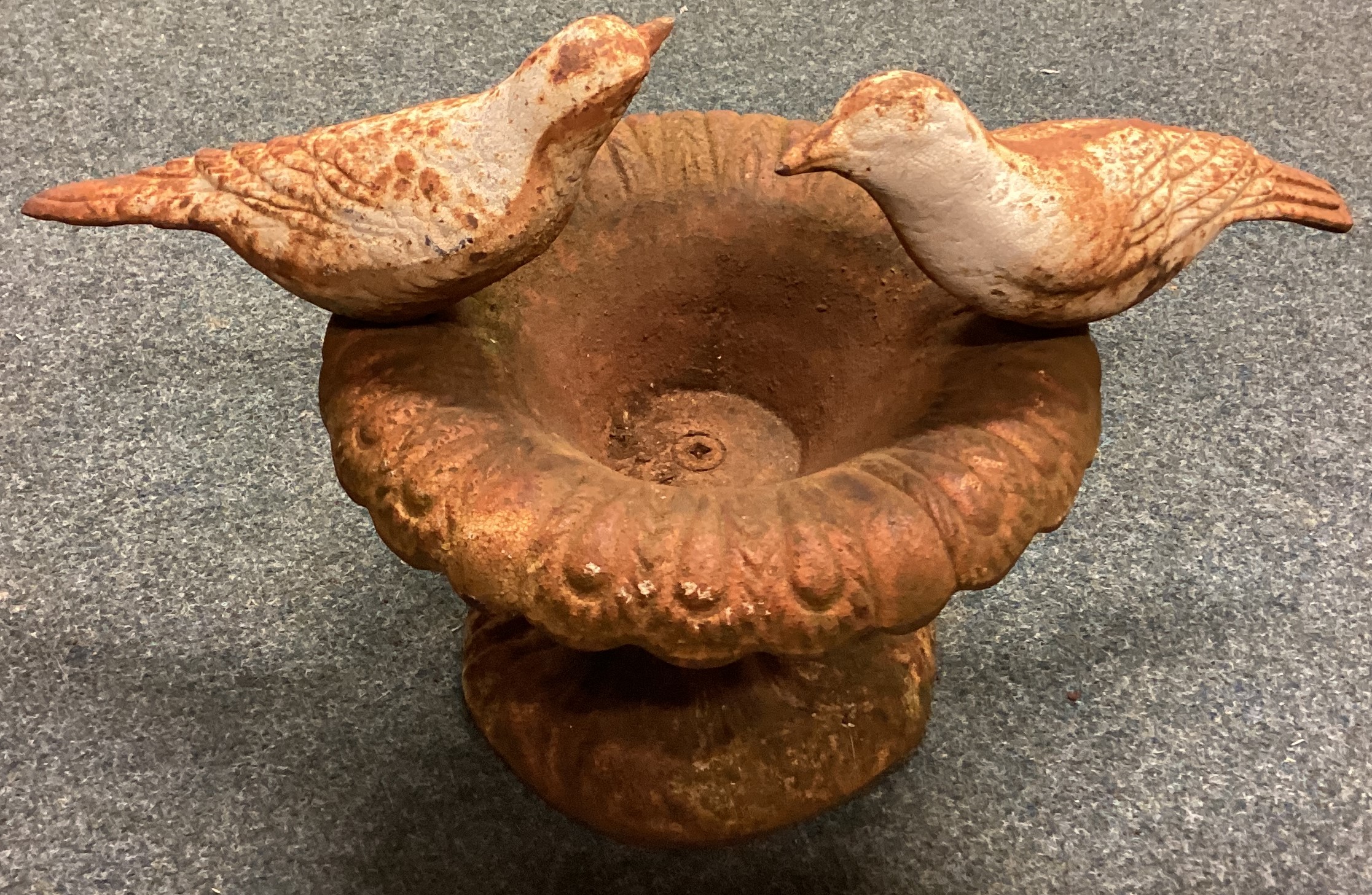 A small cast iron bird bath.