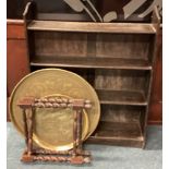 A small oak shelf together with a brass tray.