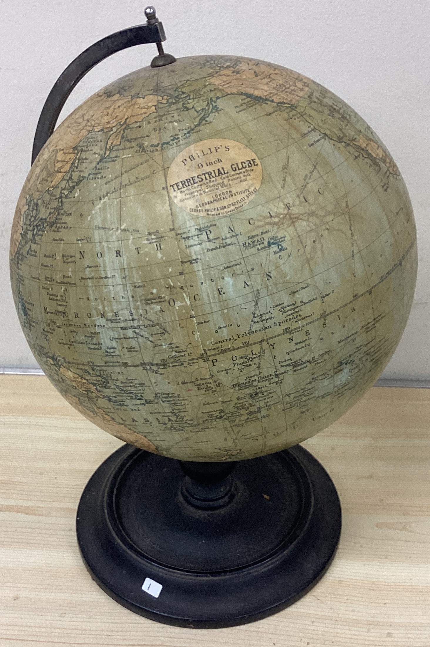 A globe on wooden stand.