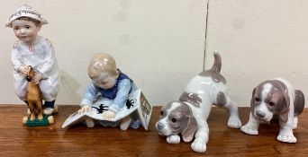 A good pair of Continental porcelain figures together with two Lladró dogs.