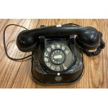An old Bakelite black telephone.