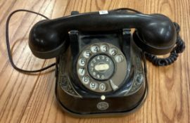 An old Bakelite black telephone.
