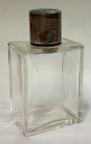 A silver and enamelled scent bottle.