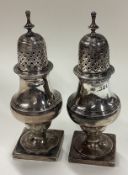 A pair of Victorian silver casters. 1892.