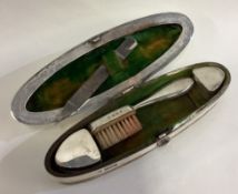 A large silver combination nail buffer with hinged lid.