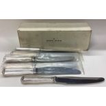 GEORG JENSEN: A rare boxed set of eight silver knives.