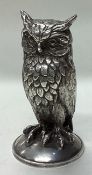 A large novelty silver figure of an owl.