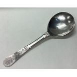 An 18th Century Norwegian silver spoon with engraved floral decoration to terminal.