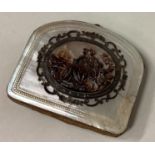 An 18th Century silver and MOP purse with carved scene to centre.