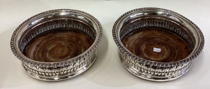 A large pair of George III silver coasters.