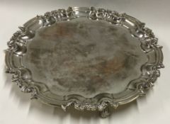 A heavy circular silver salver of typical form.