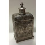 A 19th Century Dutch silver tea caddy with embossed decoration.