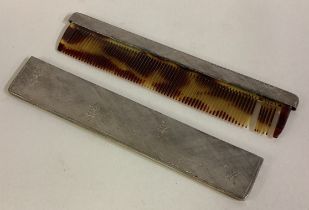 A cased French silver comb.