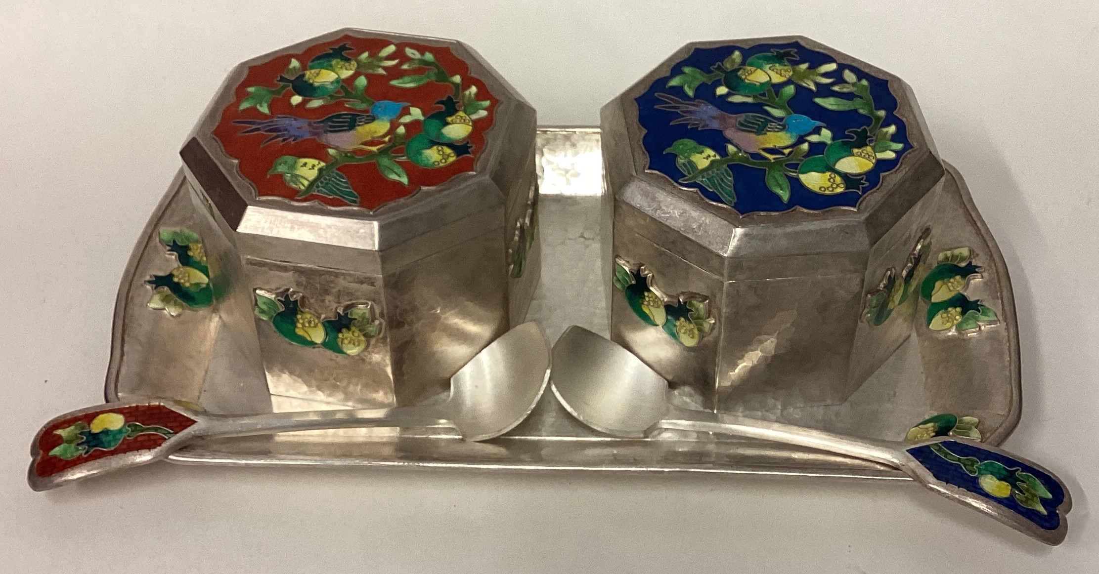 A pair of Continental silver and enamelled boxes on matching tray.