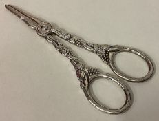 A pair of Continental silver grape scissors with vine decoration.