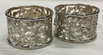 A pair of Victorian silver napkin rings with pierced decoration.