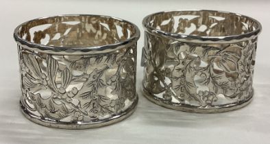 A pair of Victorian silver napkin rings with pierced decoration.