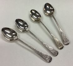 Four silver spoons with bright-cut decoration.