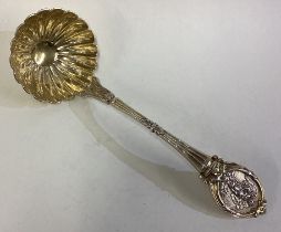 A fine silver plated gilt ladle.