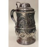 An 18th Century chased silver tankard. London 1772.