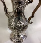 A fine and oversized George III silver coffee pot.