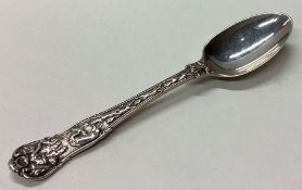 A Victorian silver spoon embossed with hunting scene.