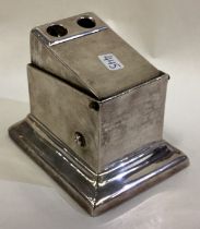 A large and heavy silver combination cigar cutter.