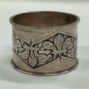 A rare Arts and Crafts silver napkin ring. Birmingham 1911. By Charles Edwards.