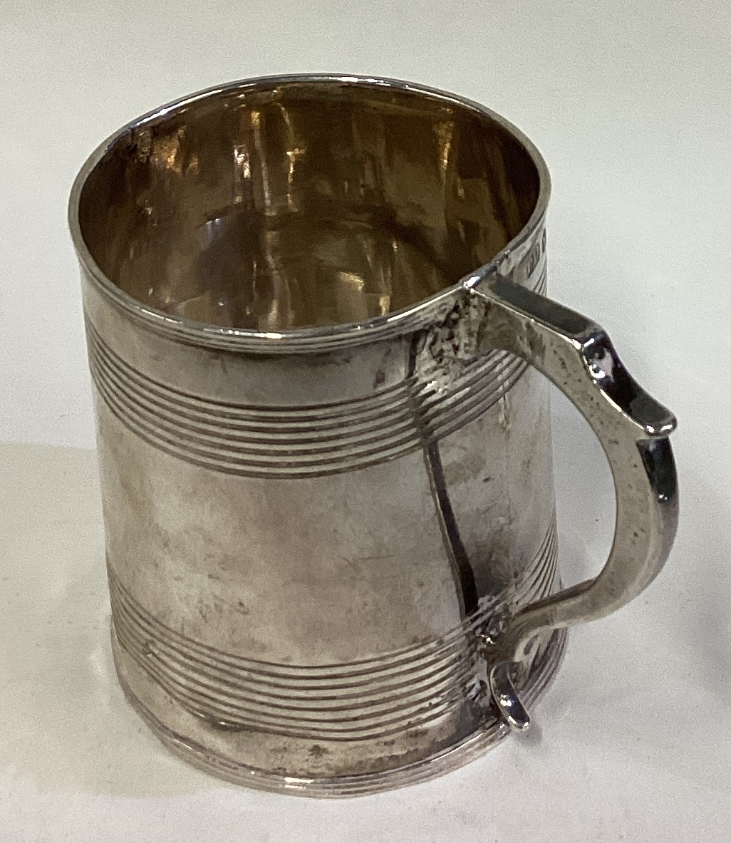 A George III silver reeded mug. London 1819. - Image 3 of 3