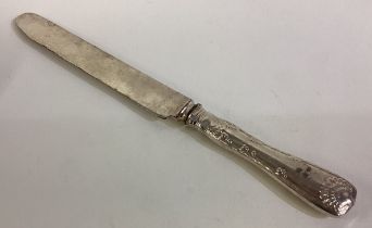 TIFFANY & CO: A large silver table knife.
